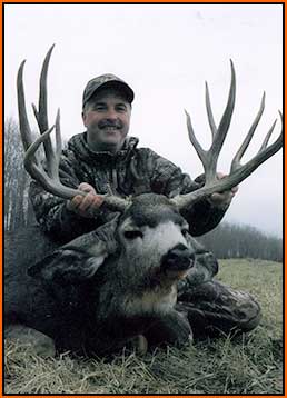 Vernon Warker with 201 Mule Deer