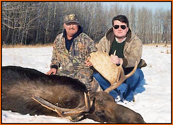 G. Copeland with guide Ed Greenwood with a bull moose